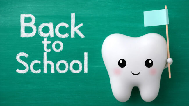 Cartoon tooth character holding flag for back to school concept
